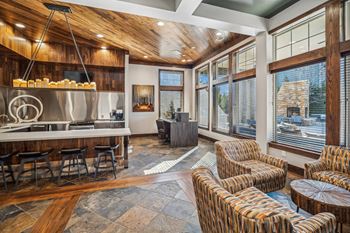Resident lounge with multiple conversation areas and media